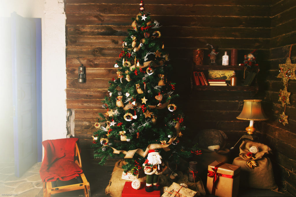 cozy holiday room with christmas tree and gifts